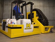 Mobulator lifting and moving an oversized tire